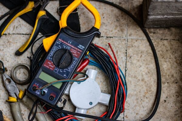 Multimeter with wires coming out of it